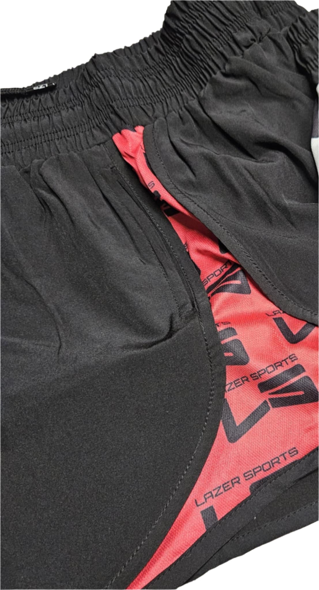 Black shorts with red interior lining featuring 'Lazer Sports' branding.